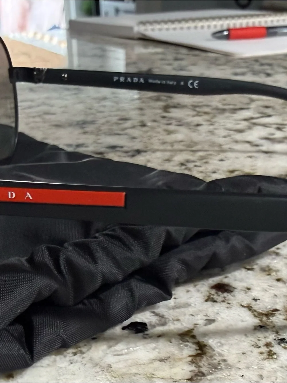 Prada Black Frame Sunglasses with Dark Lenses